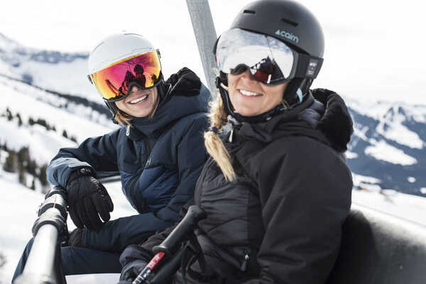 solo ski holidays - 2 girls on a ski lift