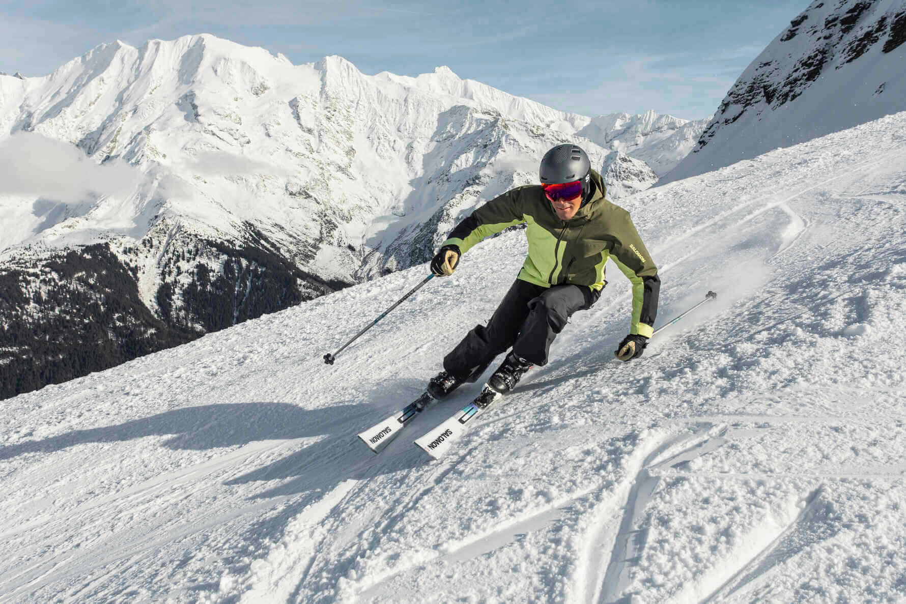 A solo skier doing a carve turn at speed