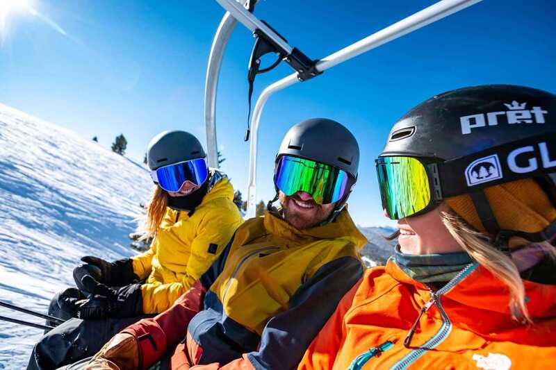 Solo ski holidays - 3 snowboarders on a ski lift